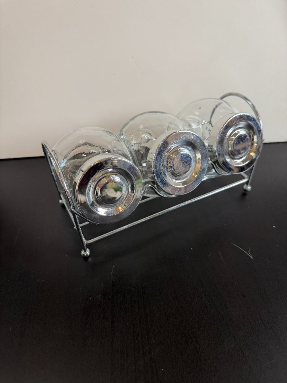 3 Clear Glass Spice Jars with Lids In a Slanted Chrome Wire Caddy Stand